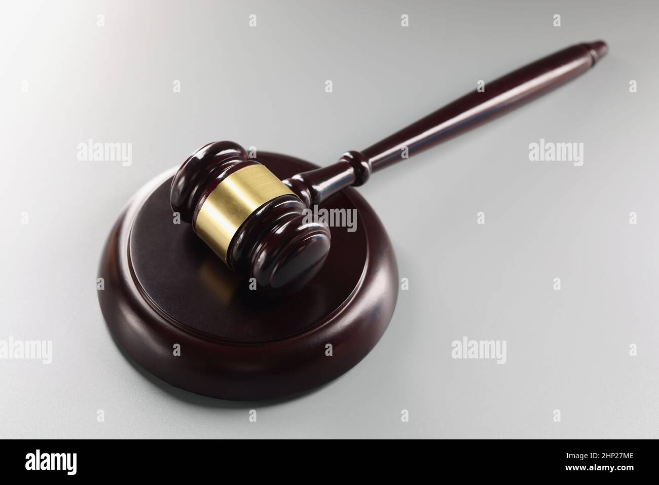 Red judge's gavel on a gray background Stock Photo Alamy