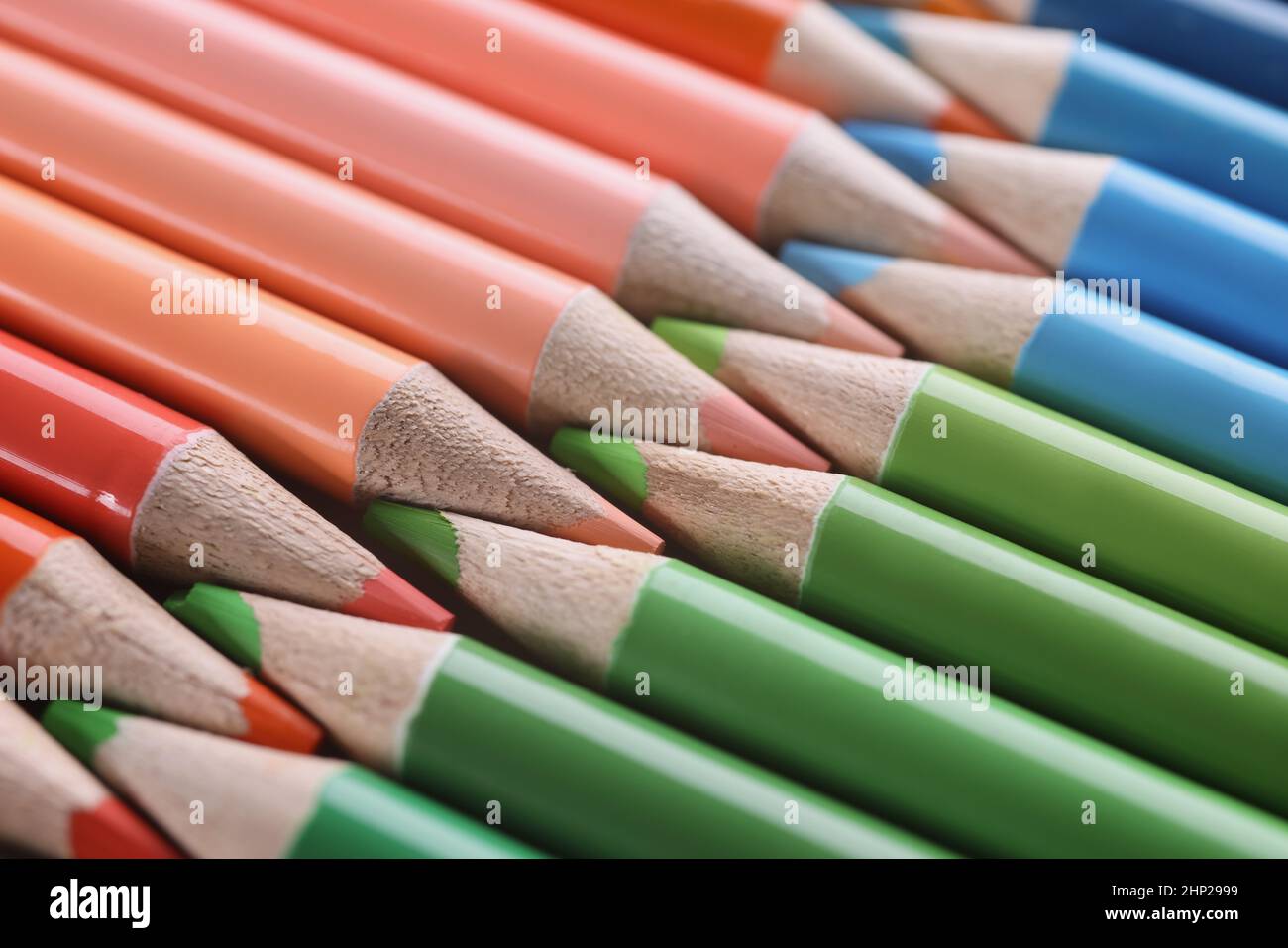 Macro sharpened red green blue pencils, blurry Stock Photo