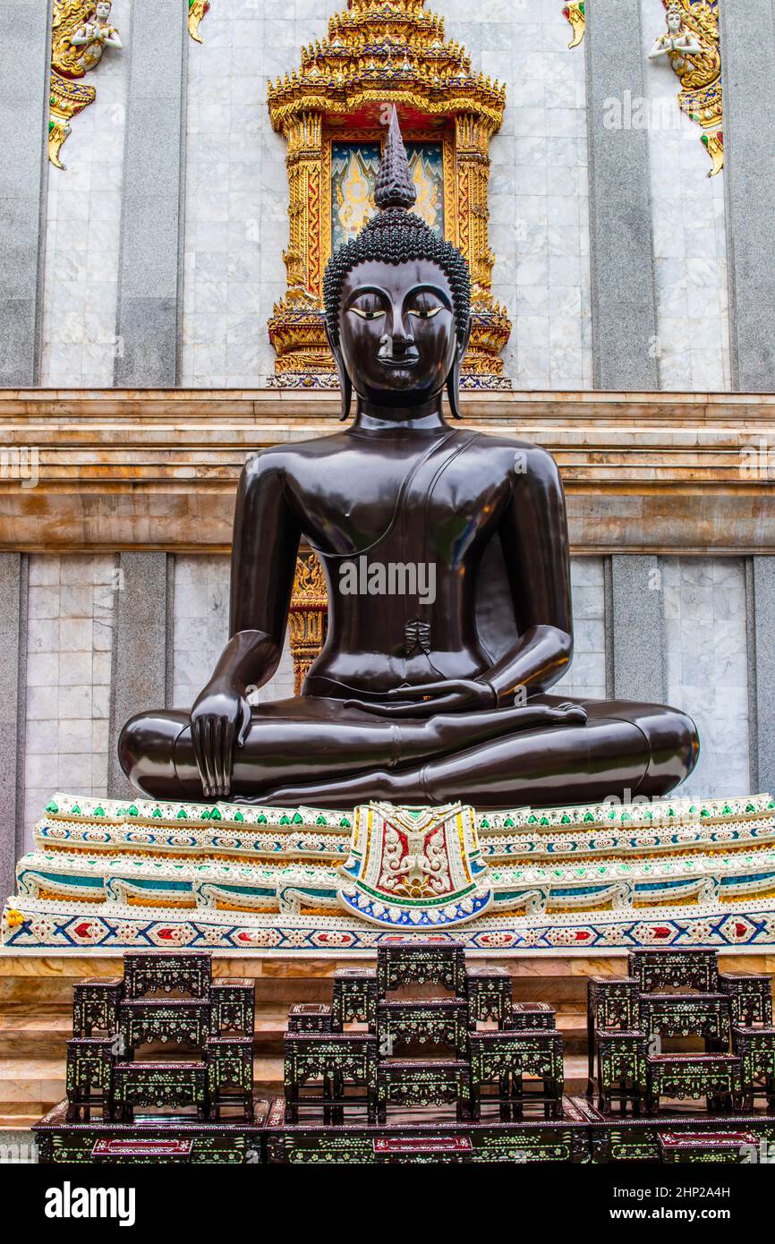 a sitting black Buddha Statue at a Buddhist Temple in