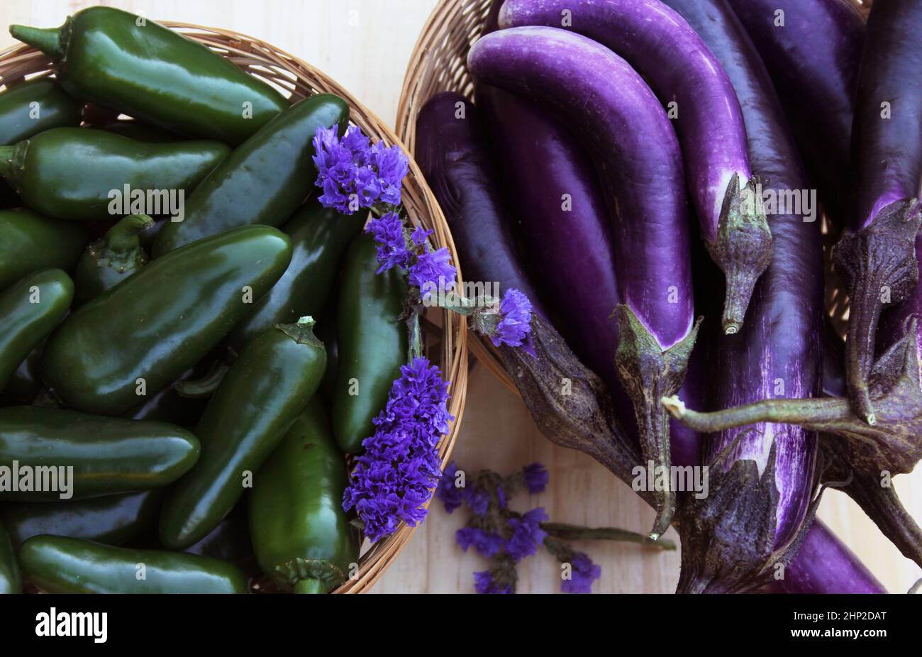 Eggplants and Jalapeno Peppers for sale in Organic Market Stock Photo ...
