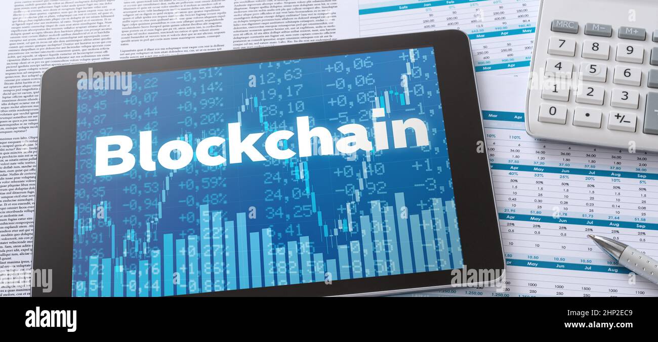 A tablet with financial documents - Blockchain Stock Photo