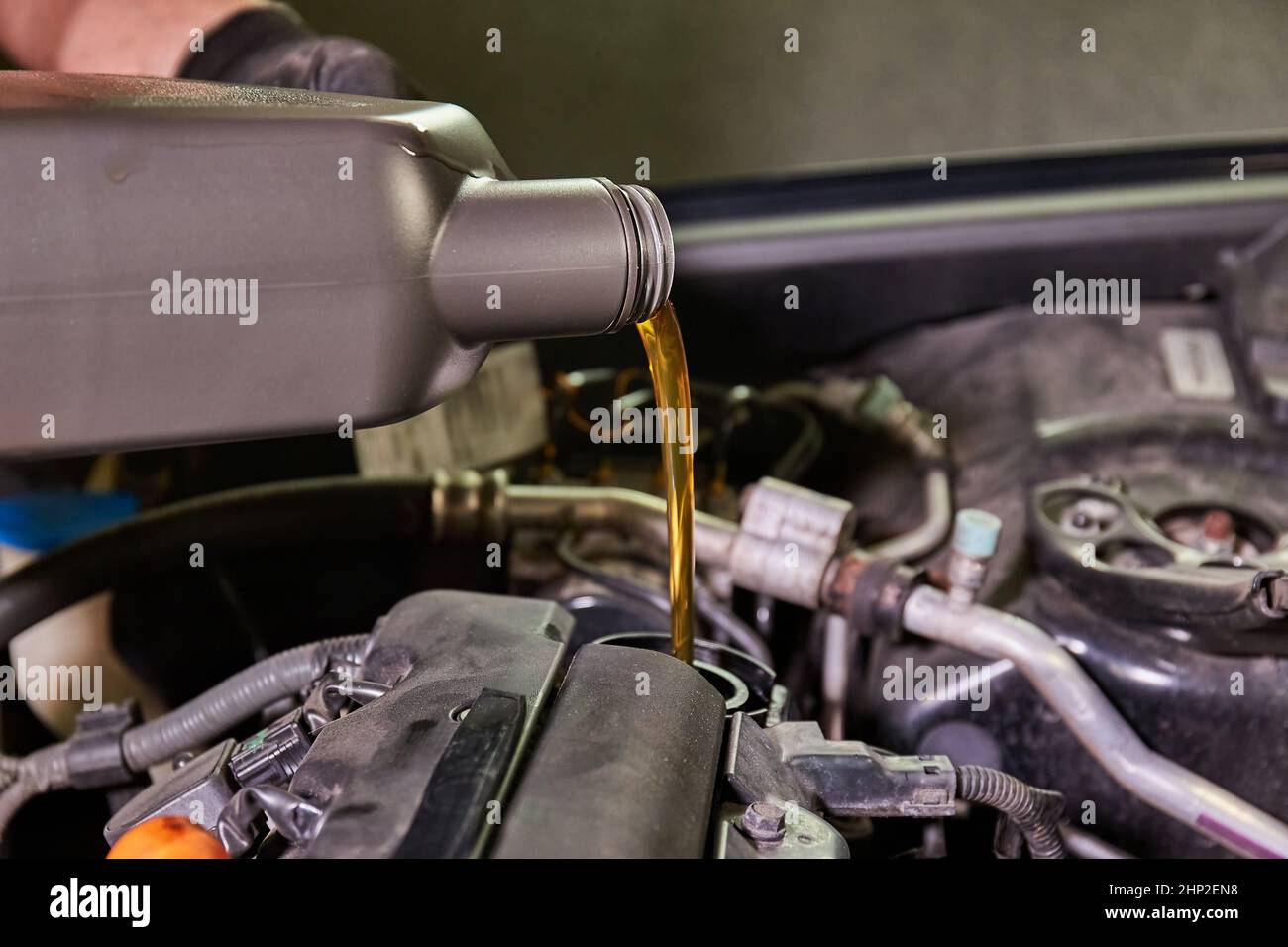 Changing oil in a car with petrol engine Stock Photo Alamy