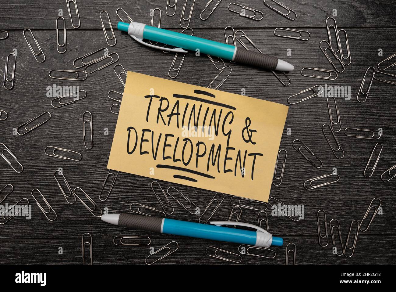Handwriting text Training And Development, Word for Organize Additional Learning expedite Skills Bright New Ideas Fresh Office Design Work Problems An Stock Photo