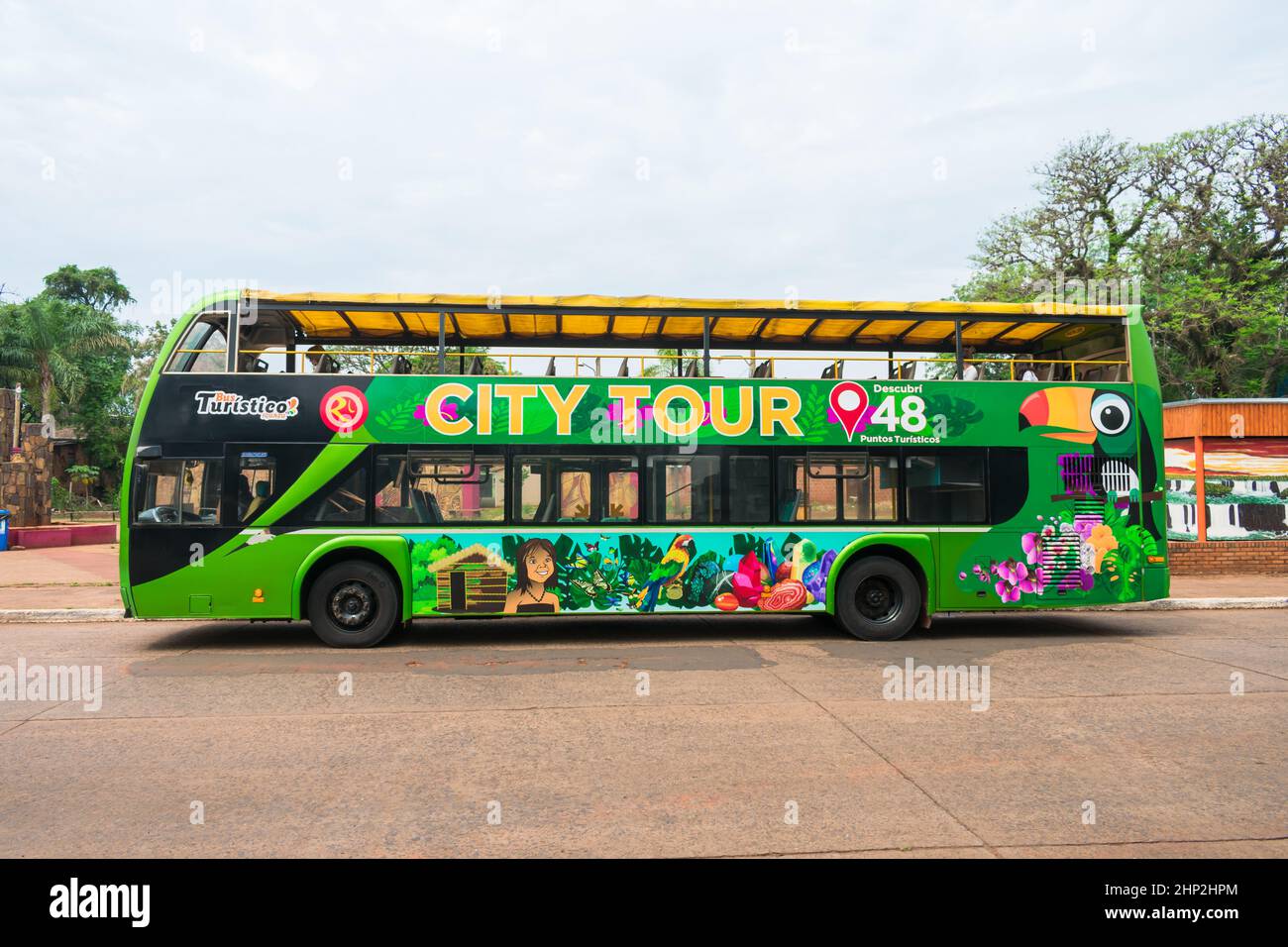 Puerto Iguazu, Argentina - Circa October 2019: City tour bus in front of Plaza San Martin main square Stock Photo