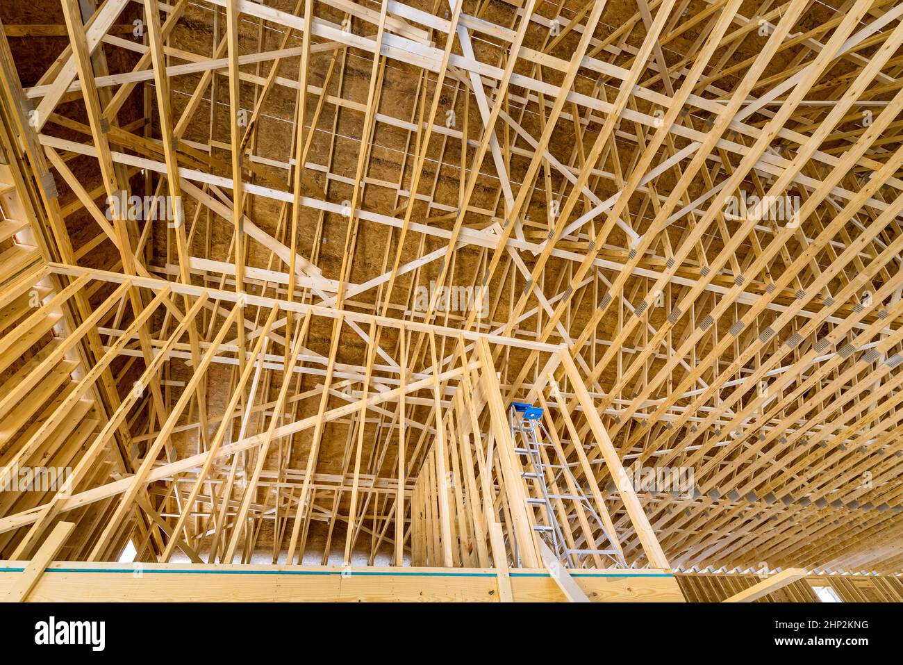 View of new residential house with wooden truss post beam stick built
