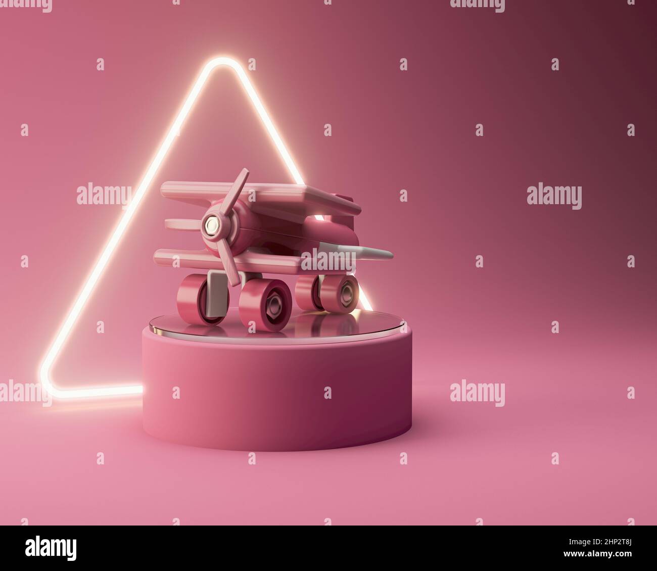 A regular pink plastic toy aeroplane for toddlers on a round pink stage ...