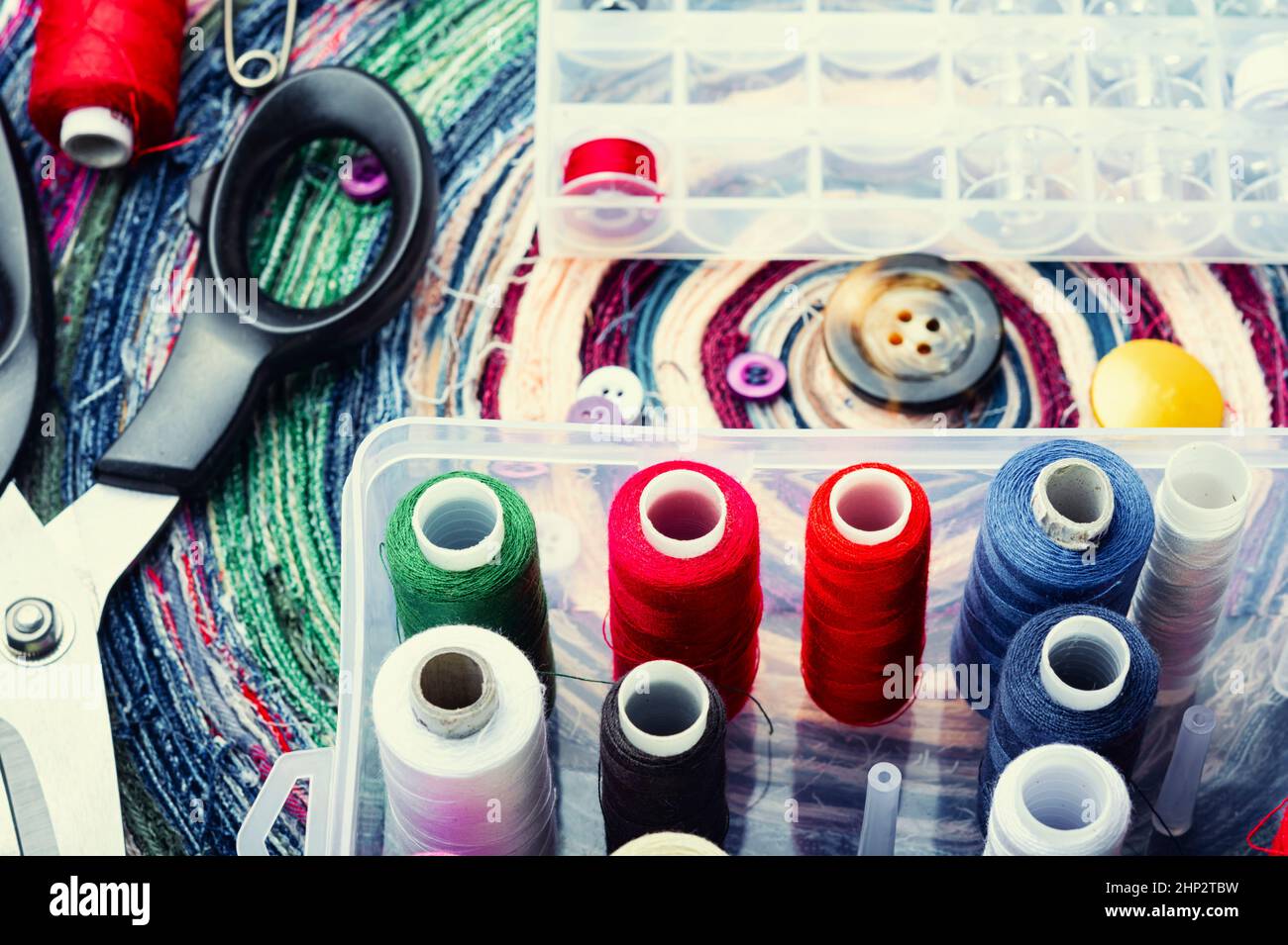 Sewing accessories of buttons, threads and needles. Needlework set ...
