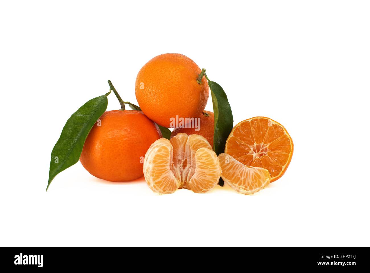 Mandarines, tangerine or clementine fruit with green leaves, peeled