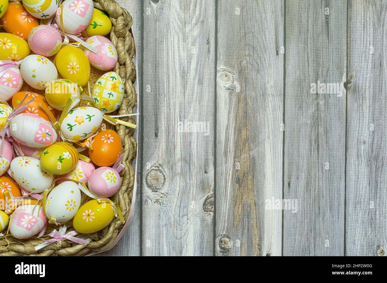 Easter egg basket colorful, hand painted. Easter background with space to write Stock Photo