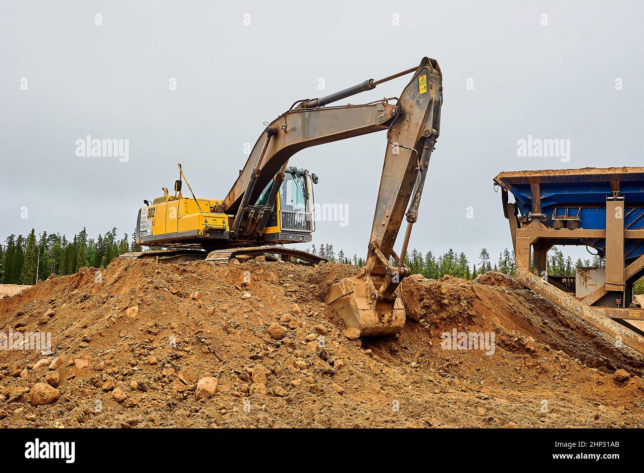 Excavator digs ground in hi-res stock photography and images - Alamy