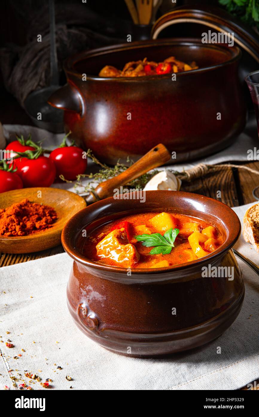 Hungarian goulash soup in a cauldron or pot Stock Photo
