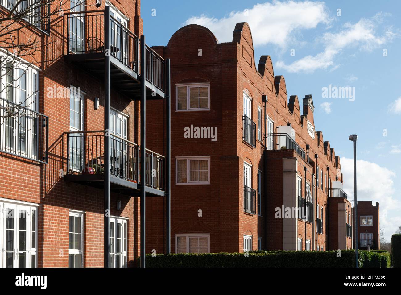 Gresham Mill in Old Woking, Surrey, England, UK, former mill and printing works now converted into apartments and houses, with Flemish style facade Stock Photo