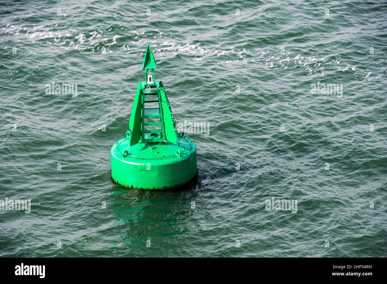 A green marker buoy in Southampton Water, UK Stock Photo Alamy