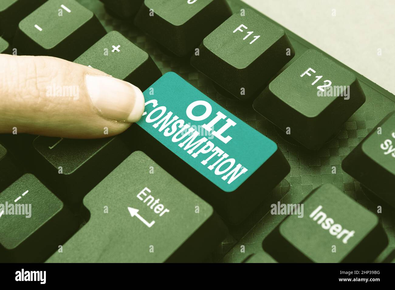 Handwriting text Oil Consumption, Internet Concept This entry is the total oil consumed in barrels per day Compiling And Typing Online Research Materi Stock Photo