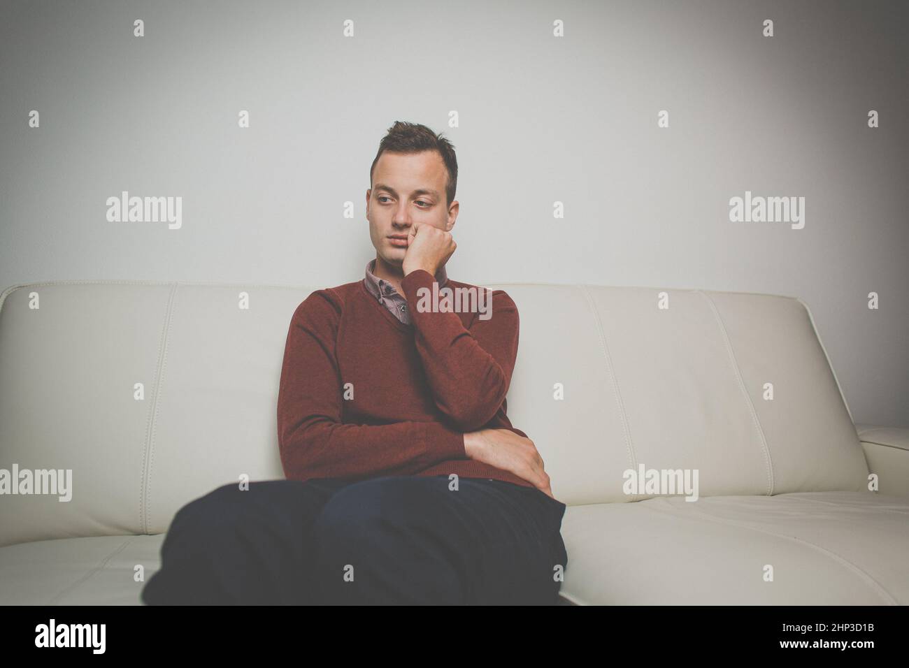 Depressed young man going through a rough patch in his life - suffering from mental exhaustion/anxiety/burnout/depression (color toned image) Stock Photo