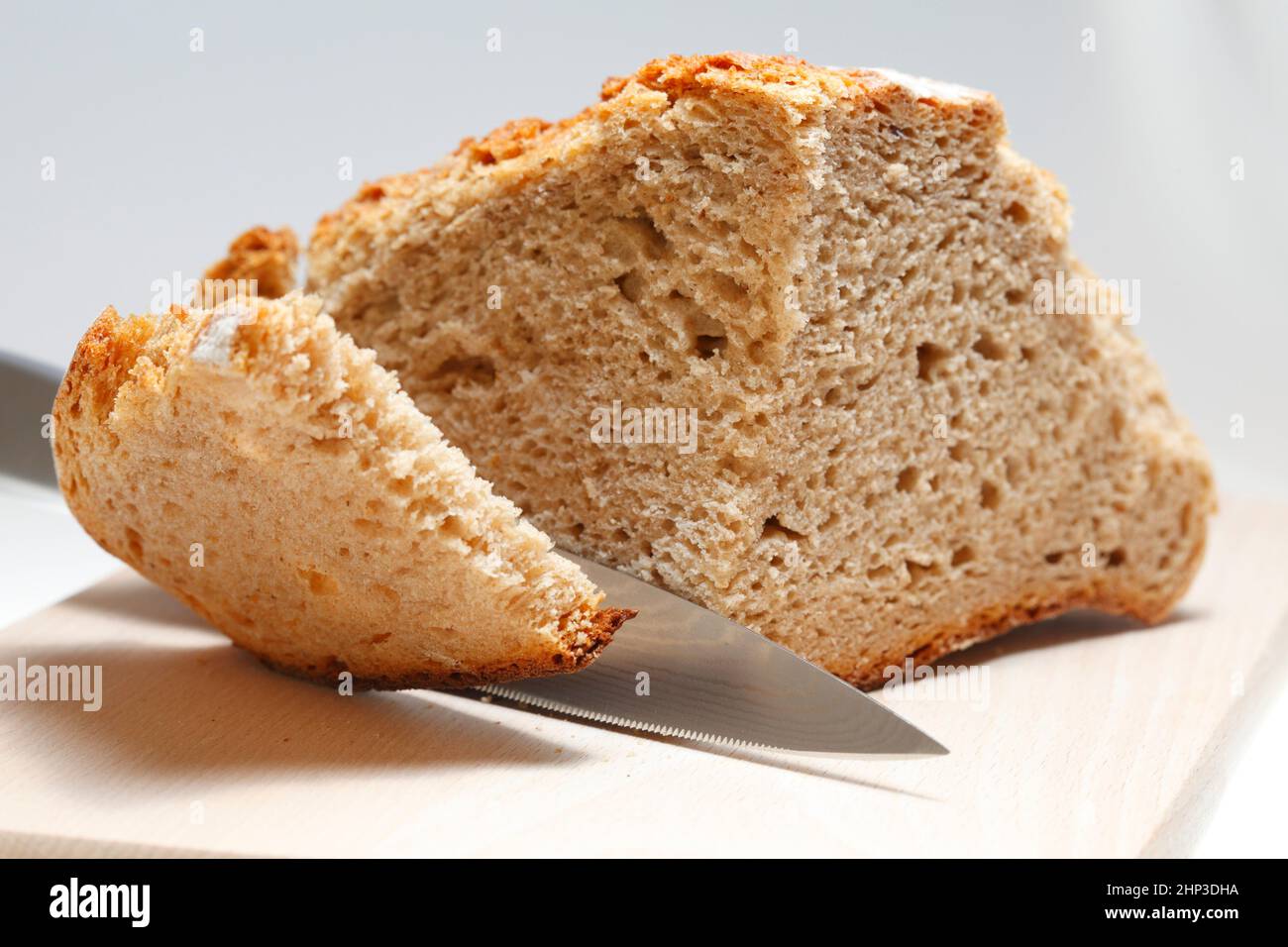 knife is bread cutting Stock Photo