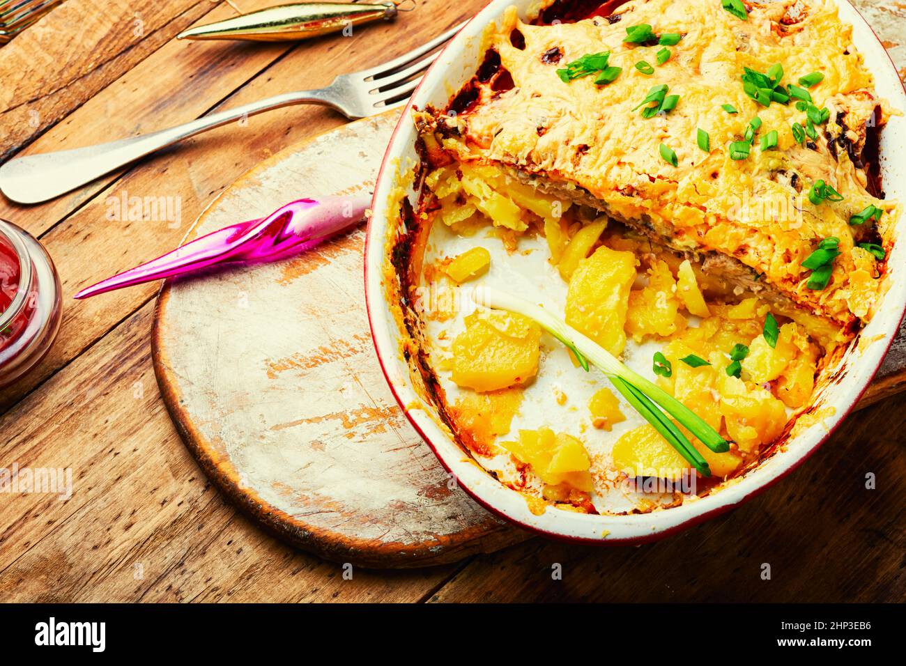 Veal, potato and cheese casserole. Meat gratin with potatoes and cheese