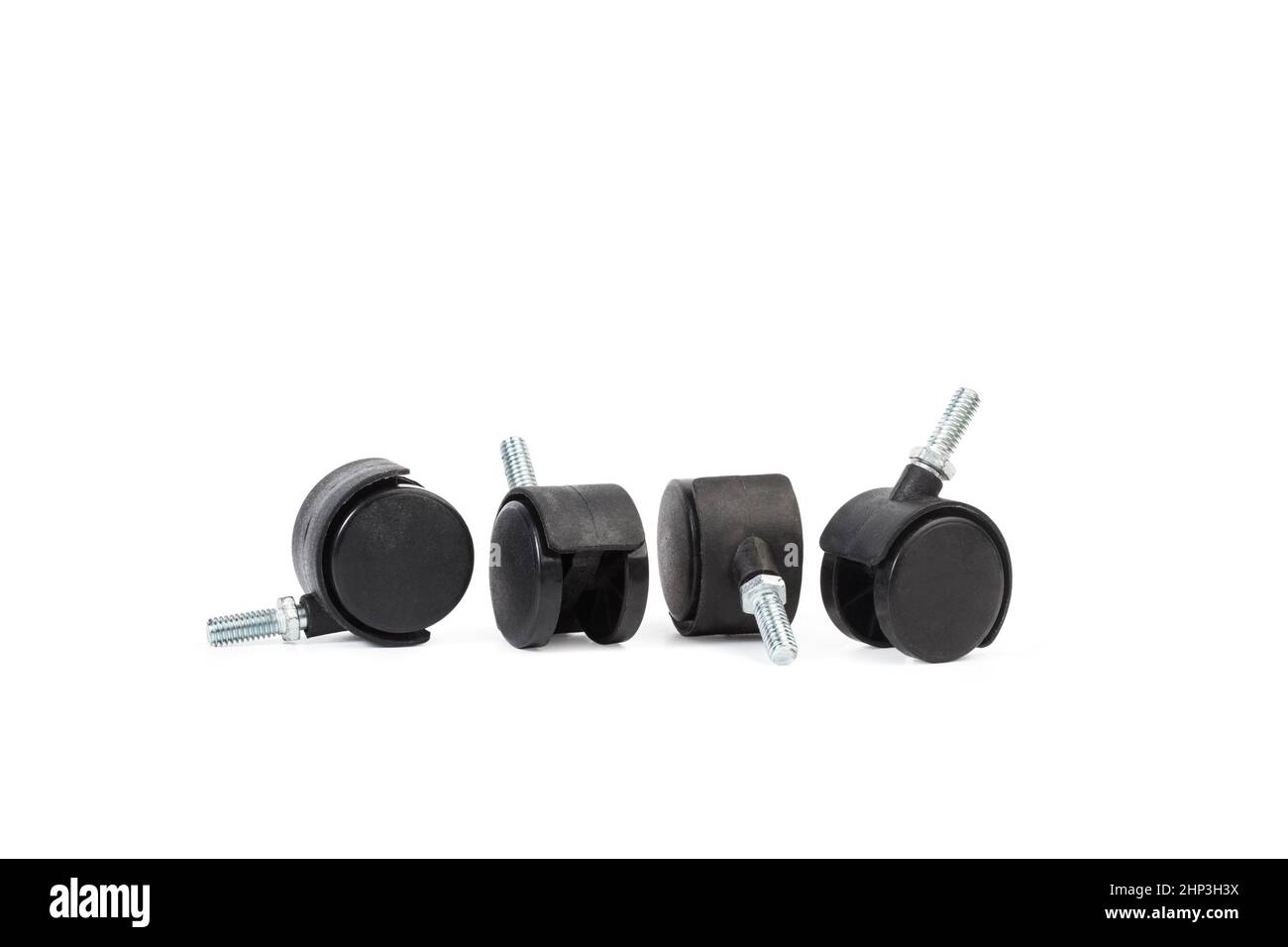 Four black plastic chair wheels isolated on a white background Stock