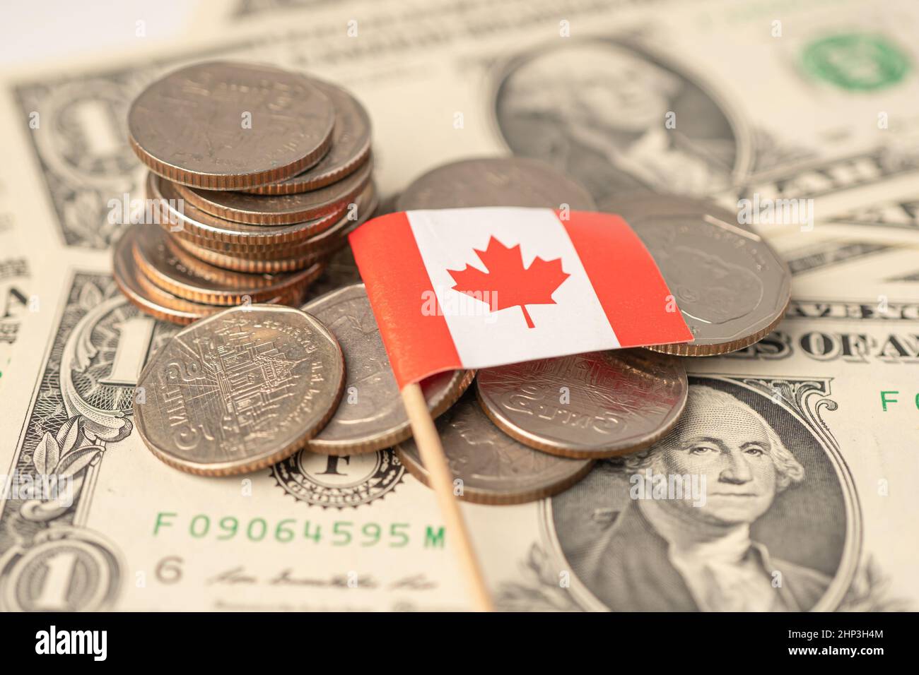Stack of coins with Canada flag on dollar banknotes Stock Photo - Alamy
