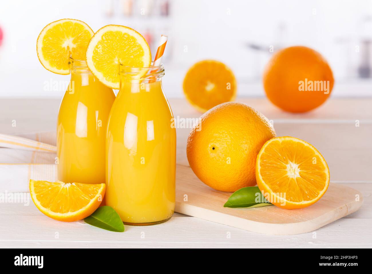 Orange juice drink in bottle on wooden board oranges Stock Photo