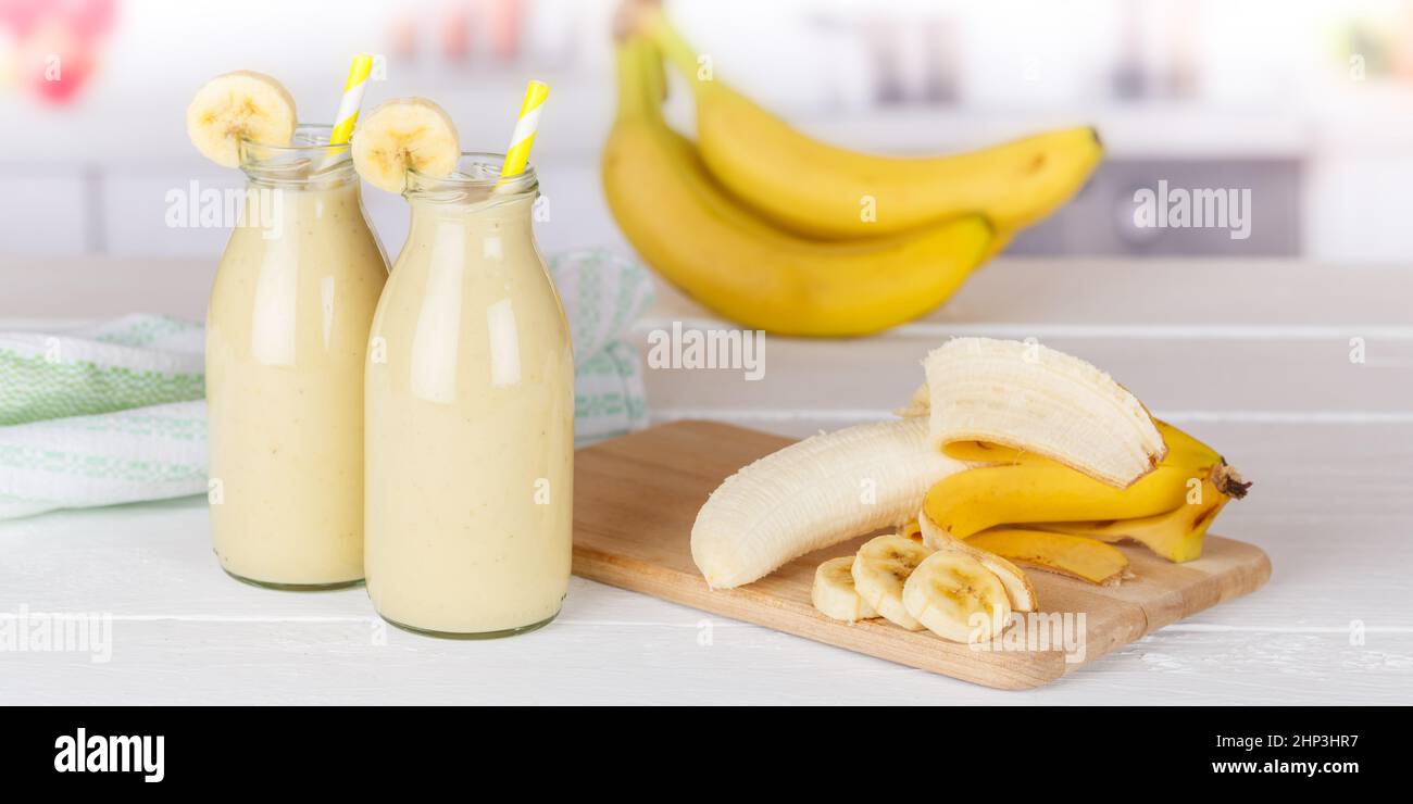 Banana fruit juice smoothie fresh drink in a bottle panorama healthy