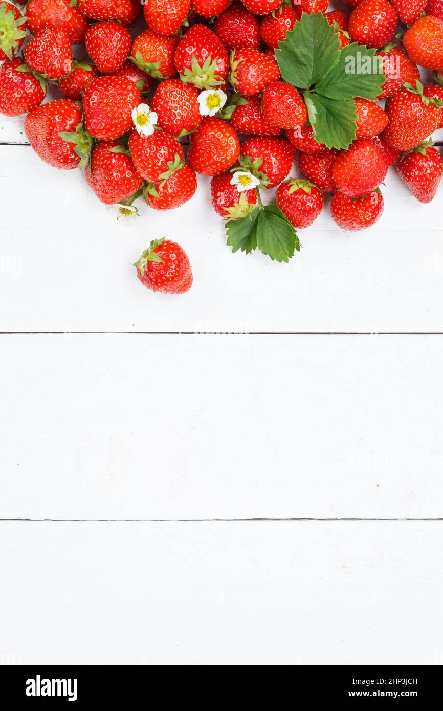 Strawberries berries fruits strawberry berry fruit with copyspace copy space on a wooden board portrait format summer Stock Photo