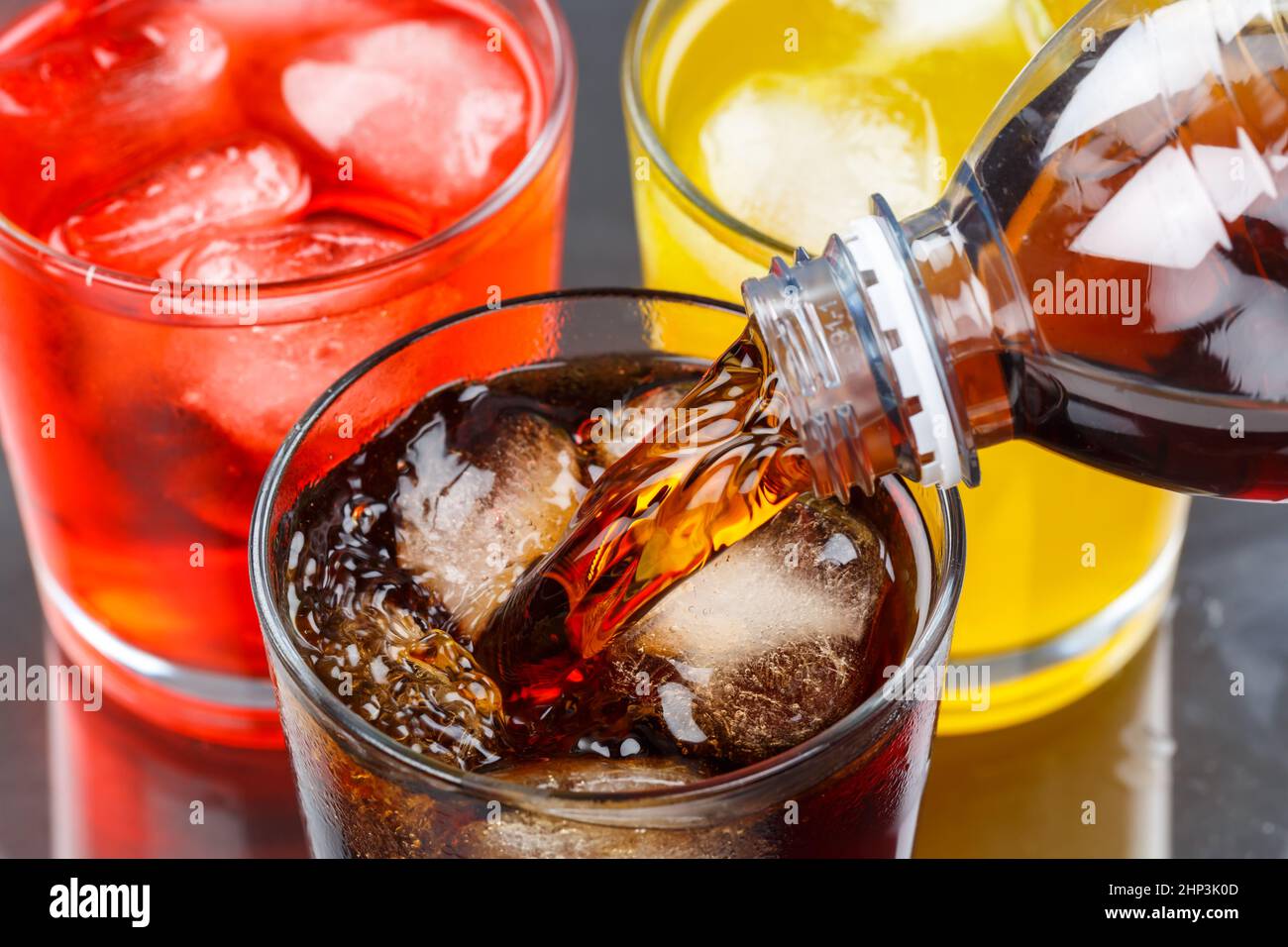Pouring cola drink drinks lemonade softdrinks in a glass pour Stock Photo