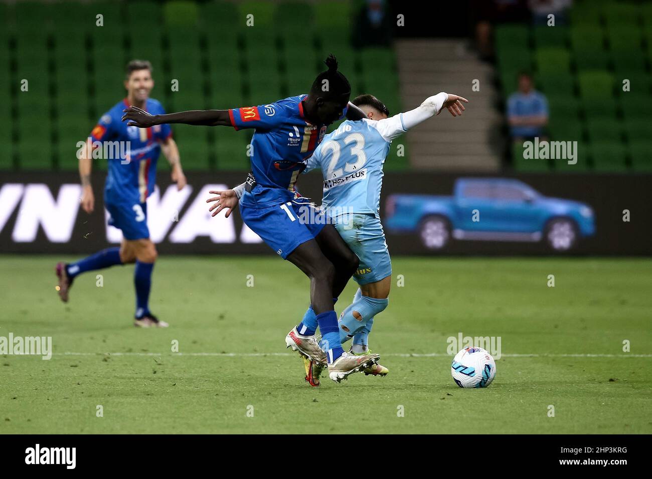 Melbourne, Australia, 18 February, 2022. Valentino Yuel of Newcastle Jets and Marco Tilio of Melbourne City FC collide during the A-League soccer match between Melbourne City FC and Newcastle Jets at AAMI Park on February 18, 2022 in Melbourne, Australia. Credit: Dave Hewison/Speed Media/Alamy Live News Stock Photo