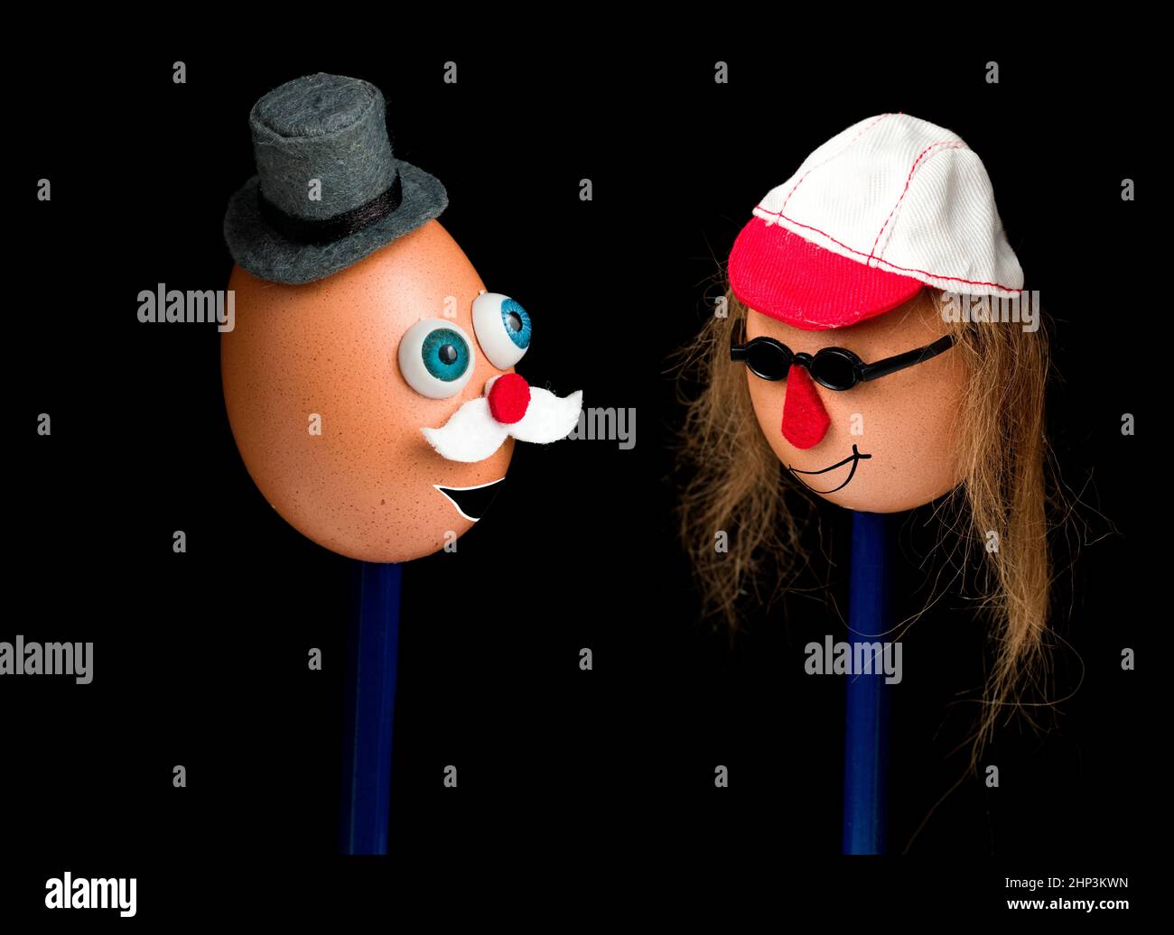 Funny couple made of eggs with faces and hats Stock Photo