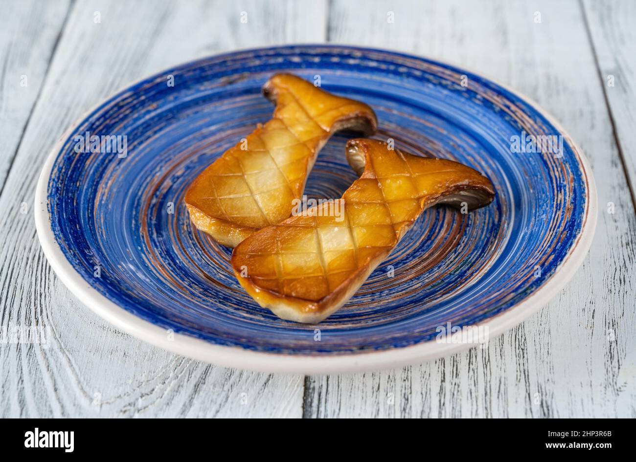 Fried king oyster mushrooms on the plate Stock Photo Alamy