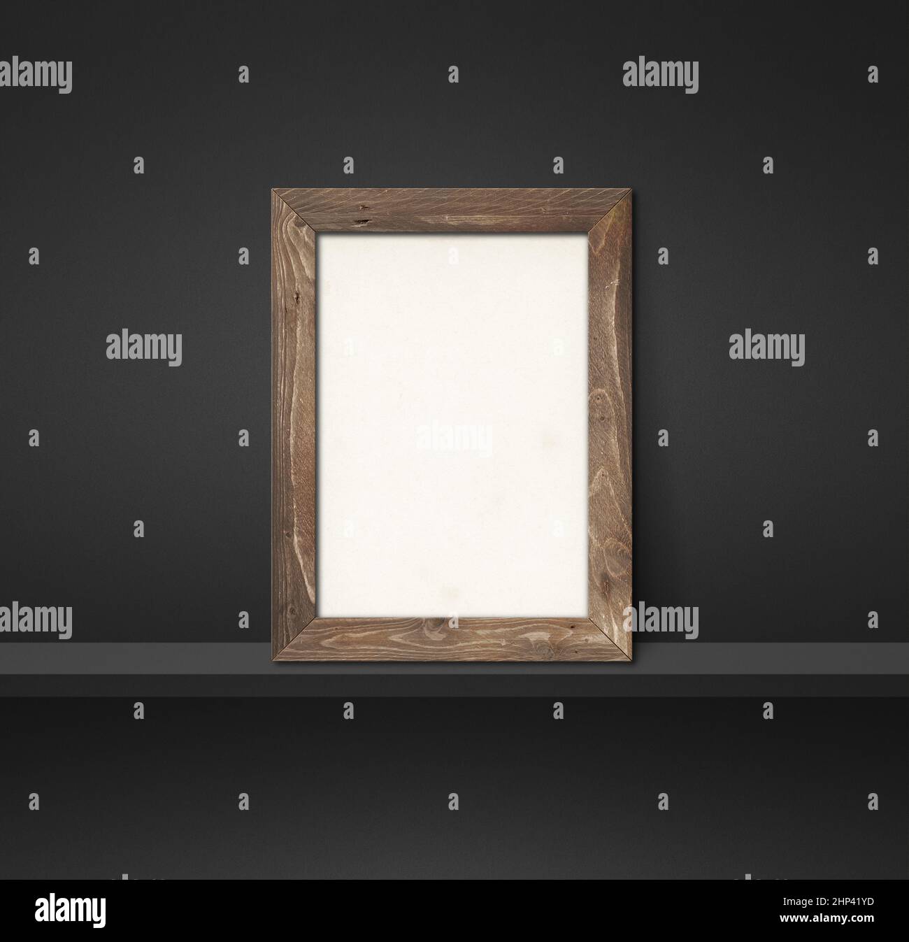 Wooden picture frame leaning on a black shelf. 3d illustration. Blank ...