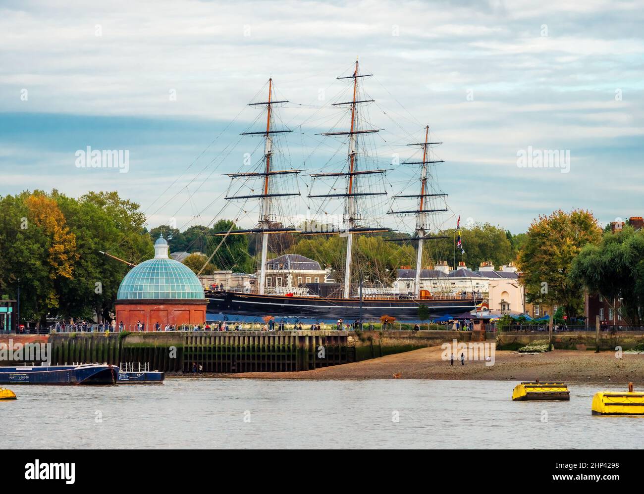 London, England, UK - October 17, 2019: View from the River Thames of the famous Cutty Sark historical ship and Greenwich Pier in fall season Stock Photo