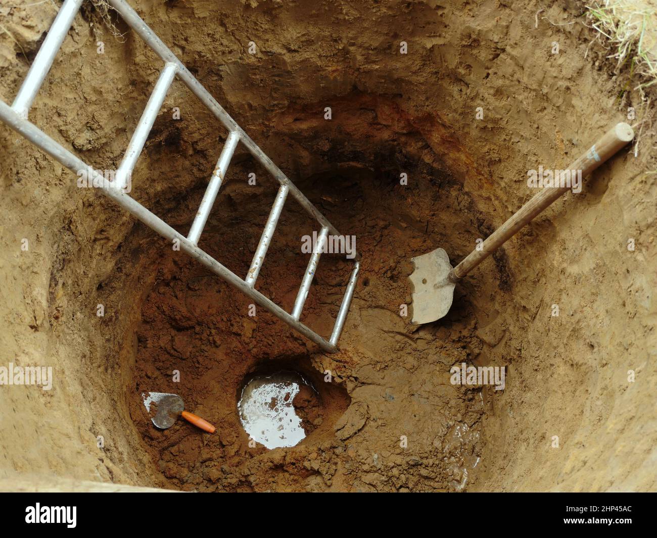 water well with hand construction tool ground top view, water has ...