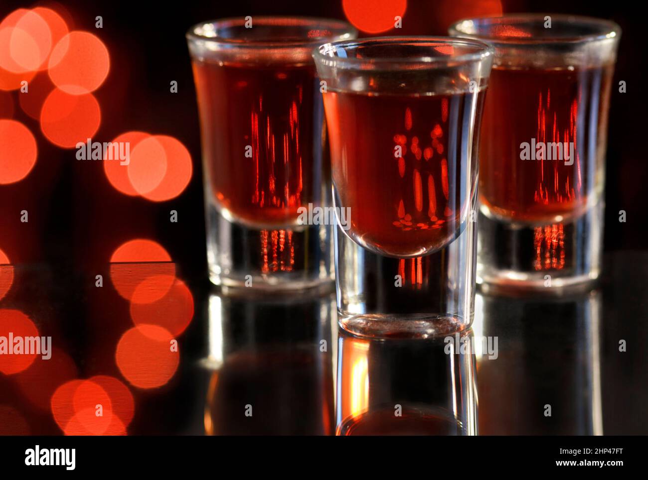 Red cocktail in shot glasses Stock Photo