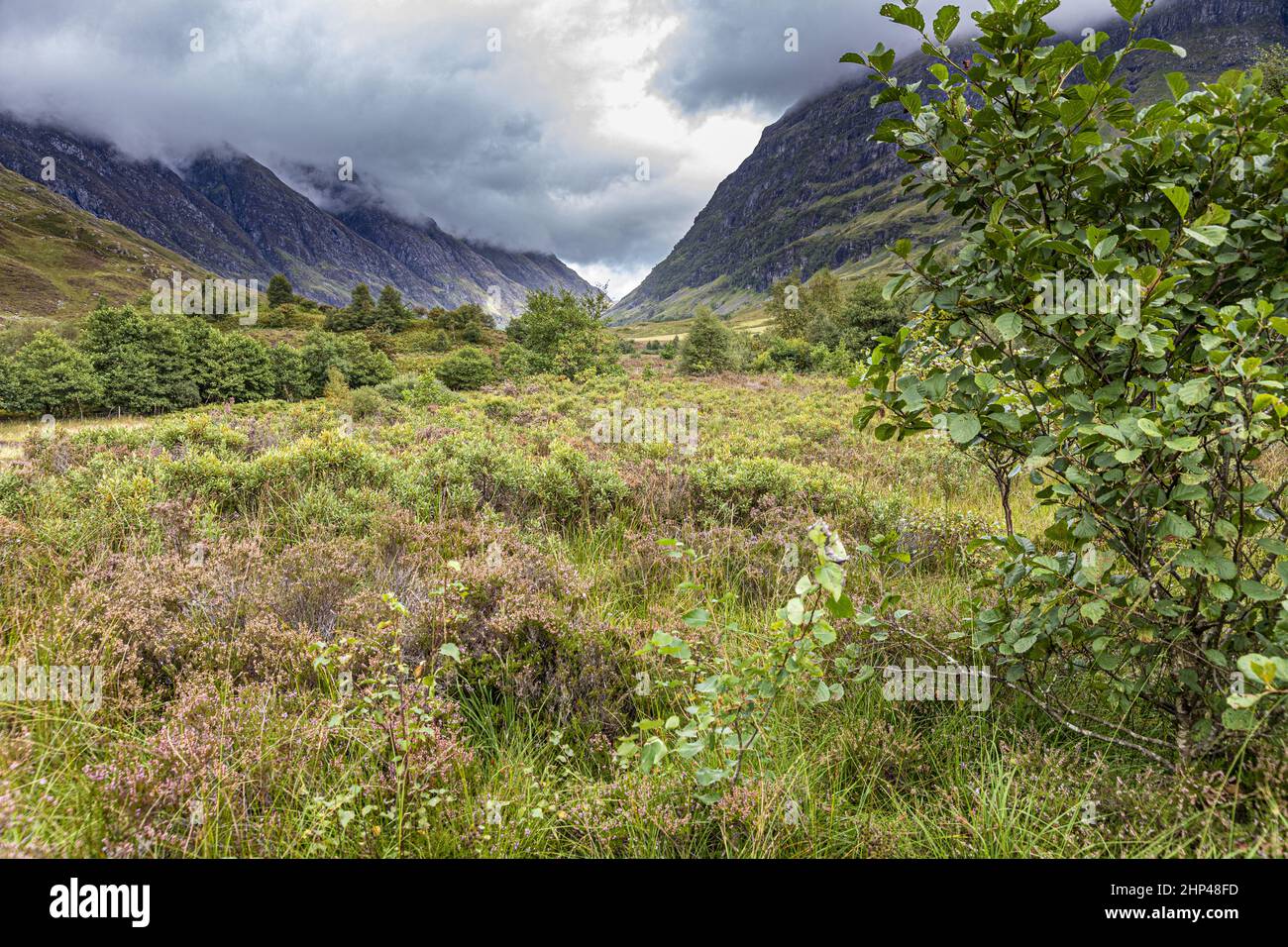 Brooding clouds hanging over the valley of Glencoe, site of the massacre in 1692, Highland, Scotland UK Stock Photo