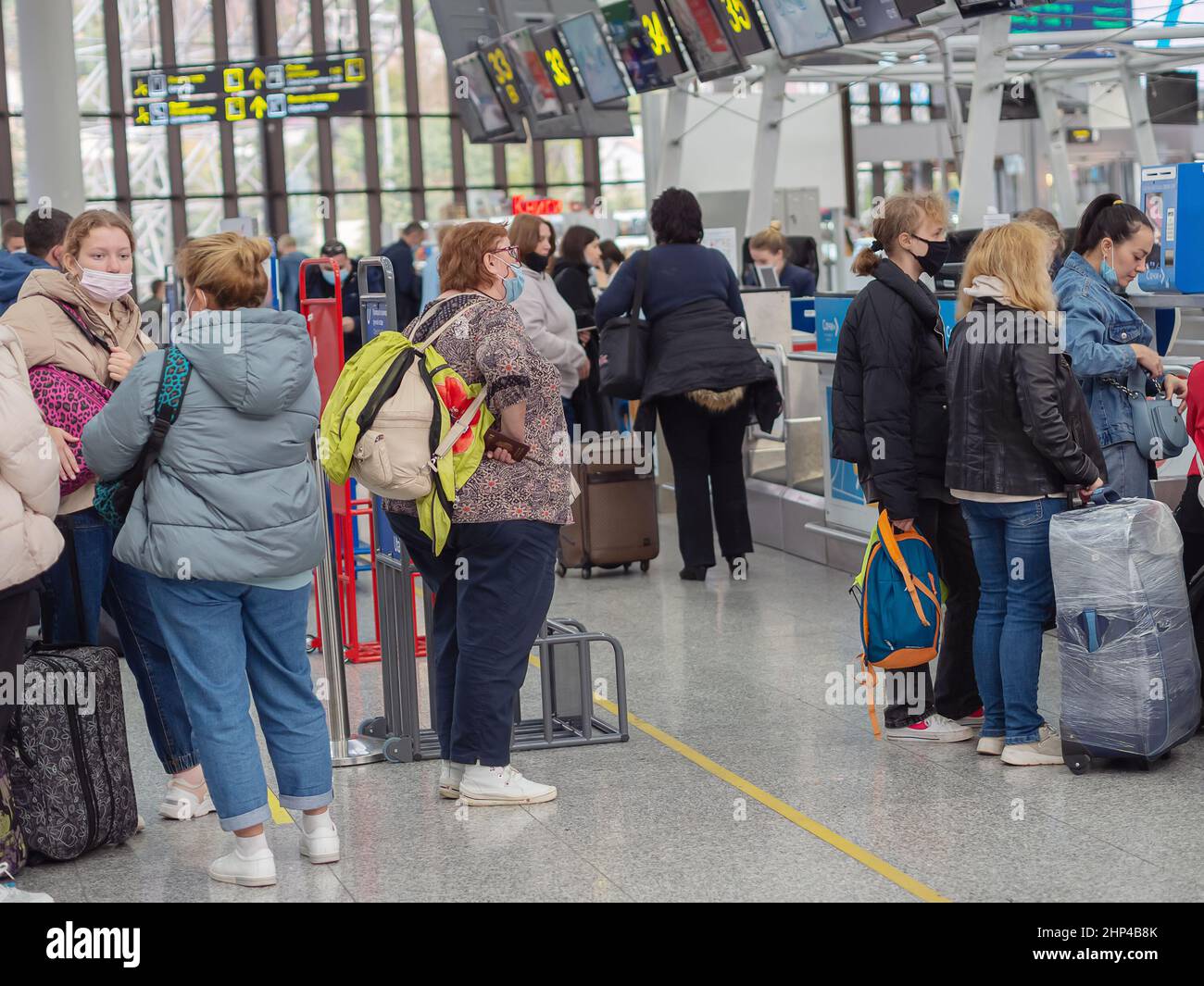 Russia, Sochi 02.11.2021. Passengers stand in line at the check-in counter for airplane flight. Flights at the airport during the coronavirus Stock Photo