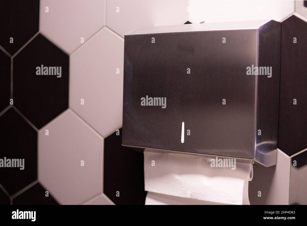 Paper napkin holder hanging on the wall Stock Photo Alamy