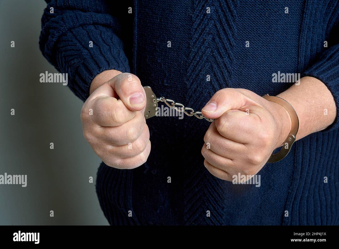 Hands in handcuffs hires stock photography and images Alamy