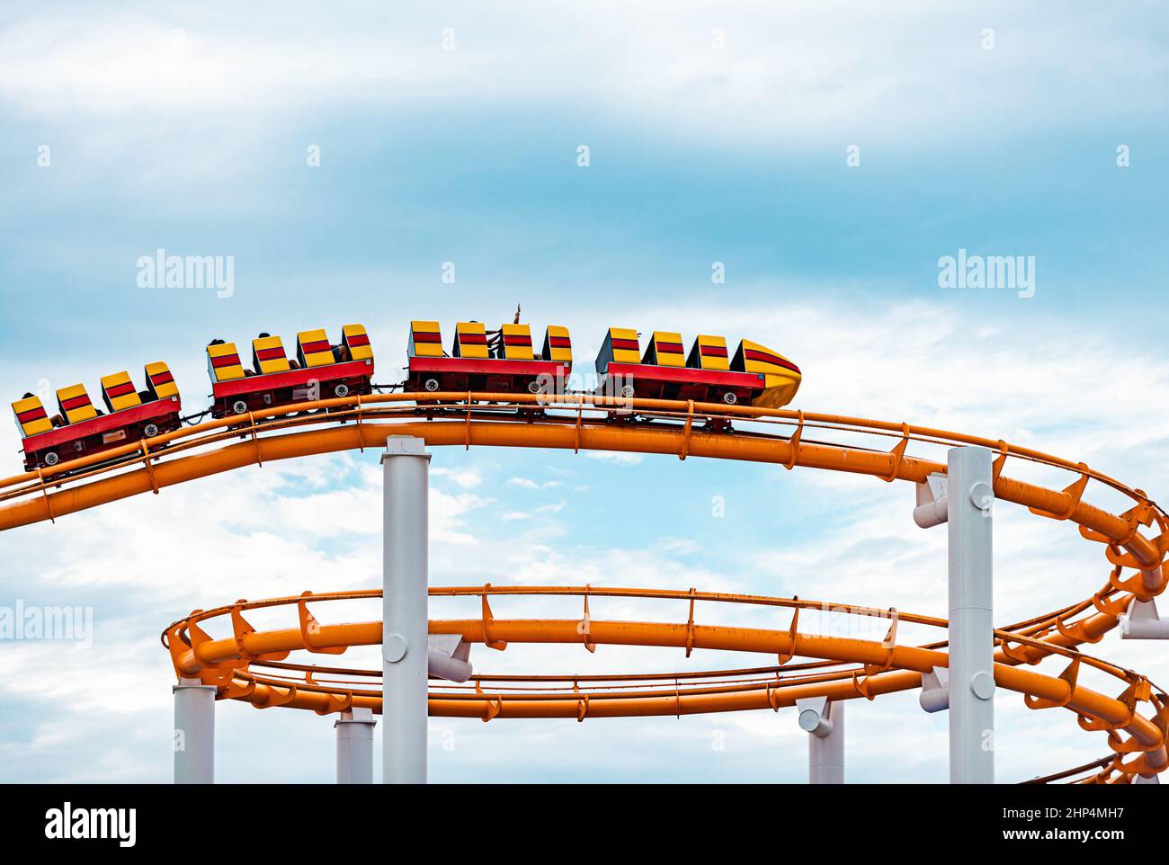 Rollercoaster in Santa Monica. Close up on carts with sky and clouds in background. California, United States of America. Stock Photo