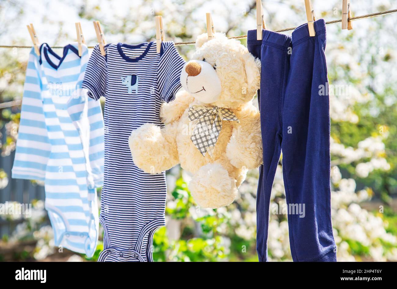 Children's clothes are dried outside. Selective focus. Nature. Stock Photo