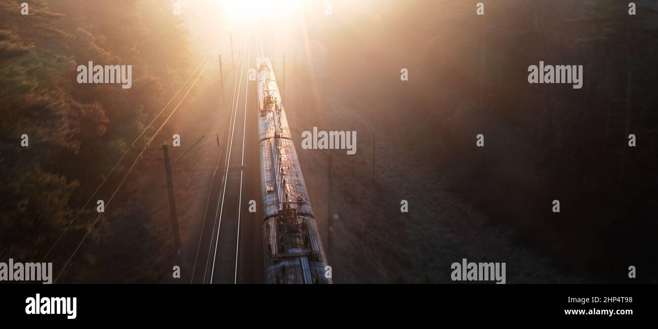 Freight train at high speed, top view, motion blur. Drone view Stock