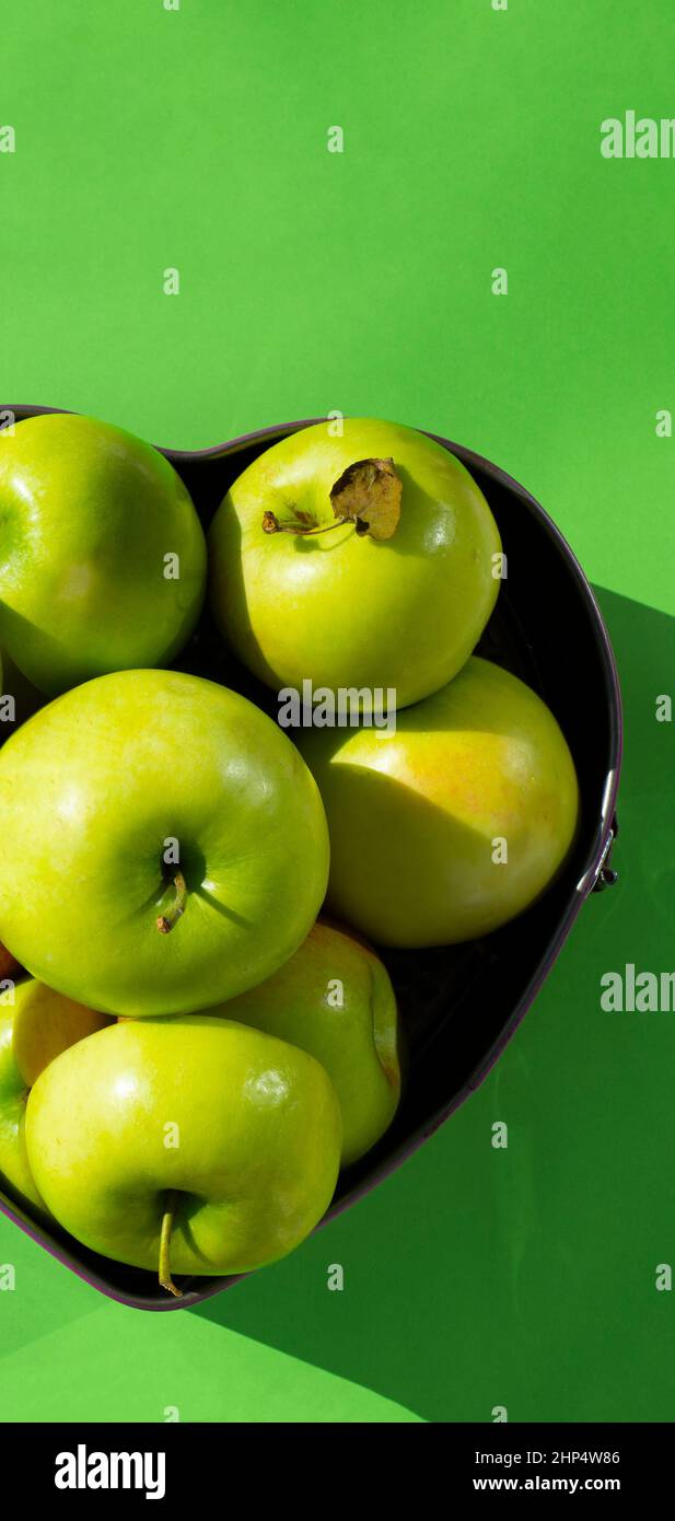 Green apples in a baking dish. Taste. Juiciness. Harvest. Copy space for text. Stock Photo