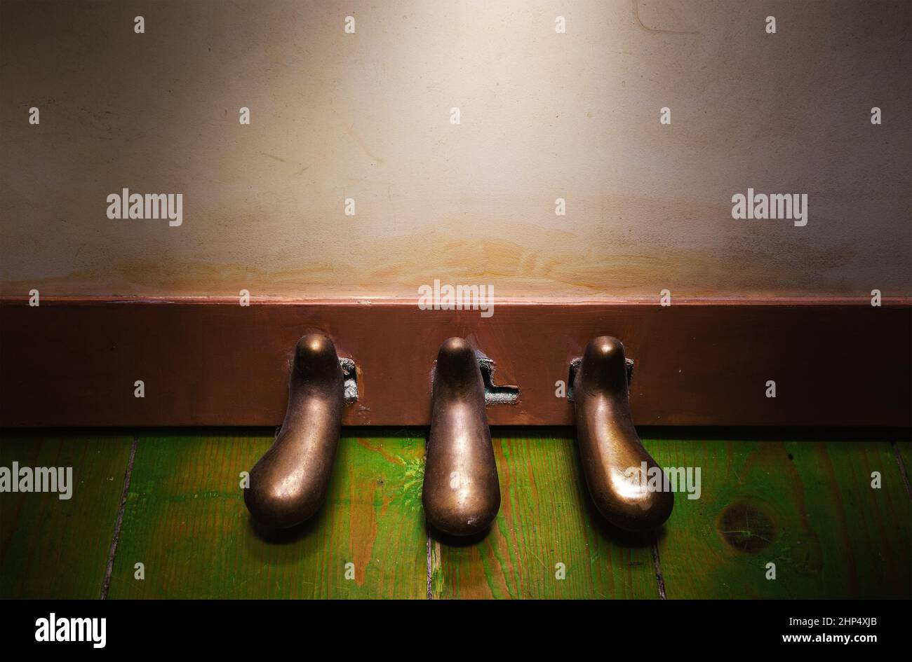 Closeup view on upright piano foot pedals on green wooden floor Stock Photo Alamy