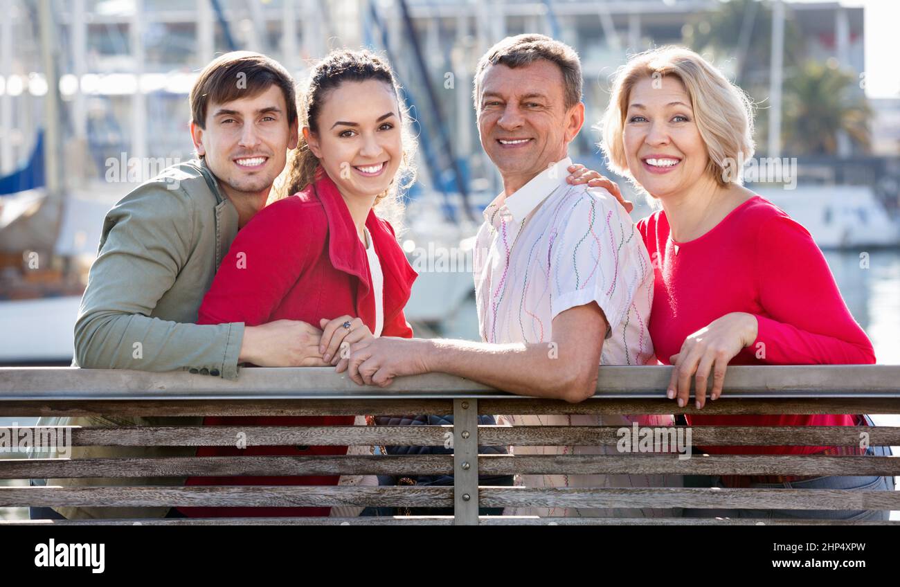 Happy family of four enjoying together near sea Stock Photo