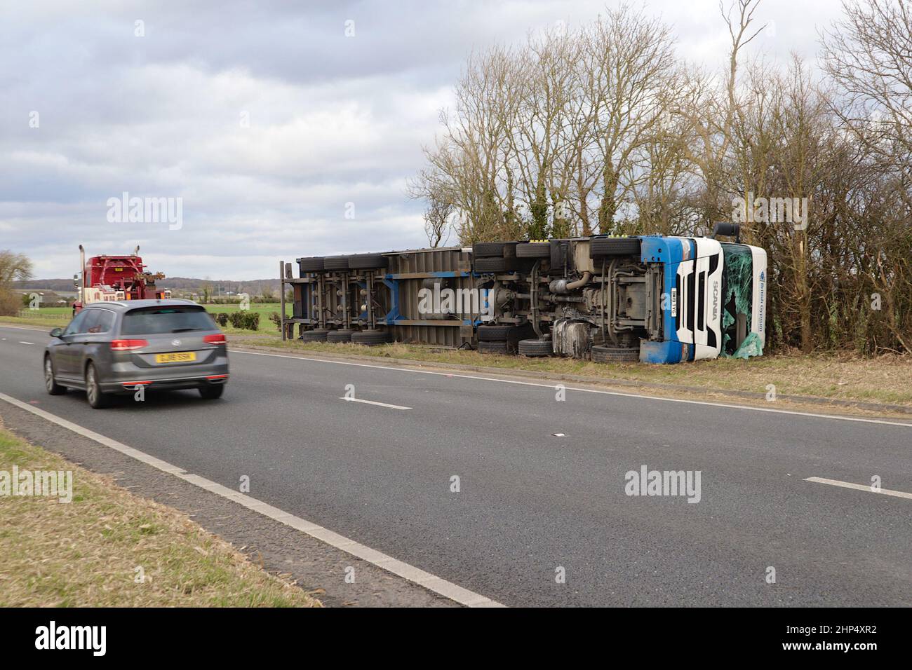 Ashford, Kent, UK. 18 Feb, 2022. UK Weather: Storm Eunice has toppled a British Gypsum lorry on the A259 near Hamstreet in Ashford, Kent. Overturned lorry. Photo Credit: Paul Lawrenson-PAL News /Alamy Live News Stock Photo