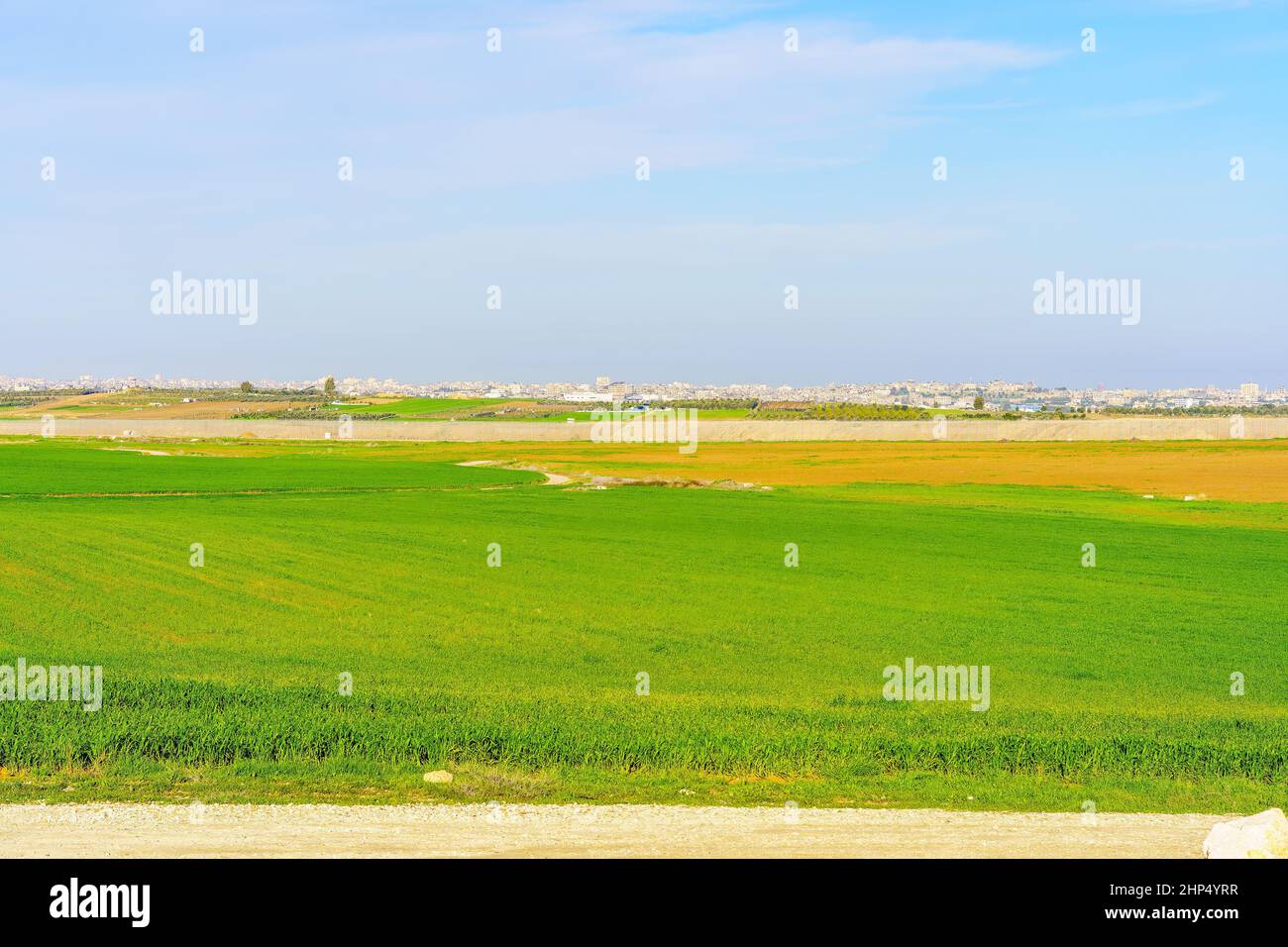 View of countryside and the city of Gaza in the background, viewed from the Northern Negev Desert, Southern Israel Stock Photo