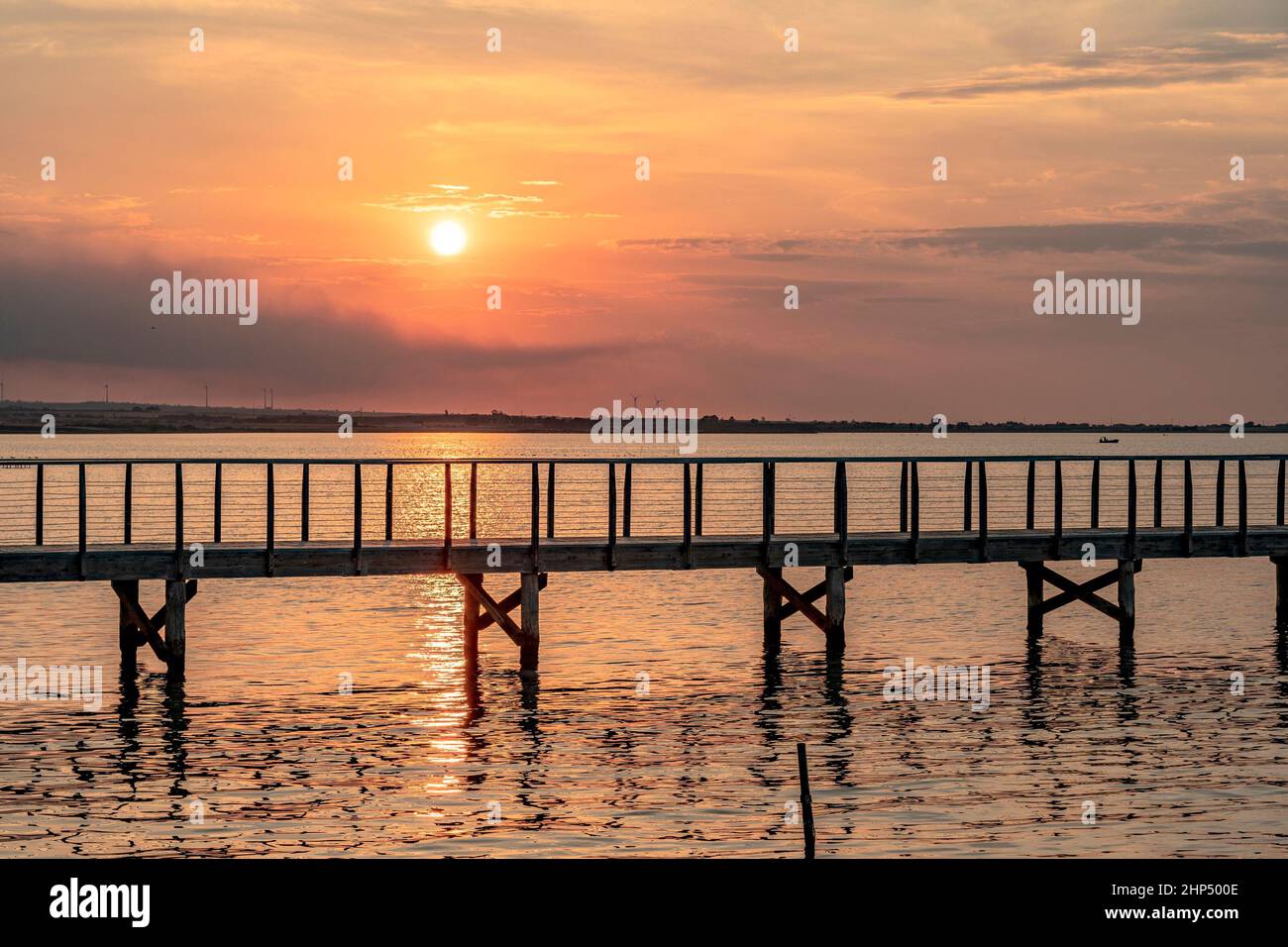 Jetty on Lake Lesina at sunset Stock Photo