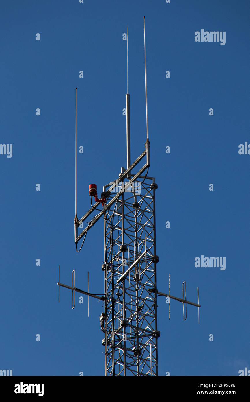 Vertical shot of details of an antenna on blue sky background Stock