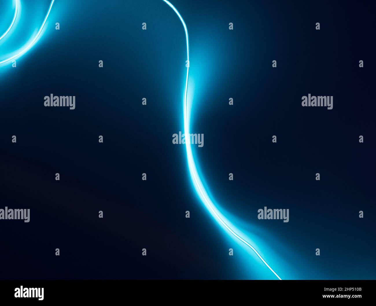 Neon blue led lines on a dark night background. Cyberpunk futuristic backdrop. Stock Photo