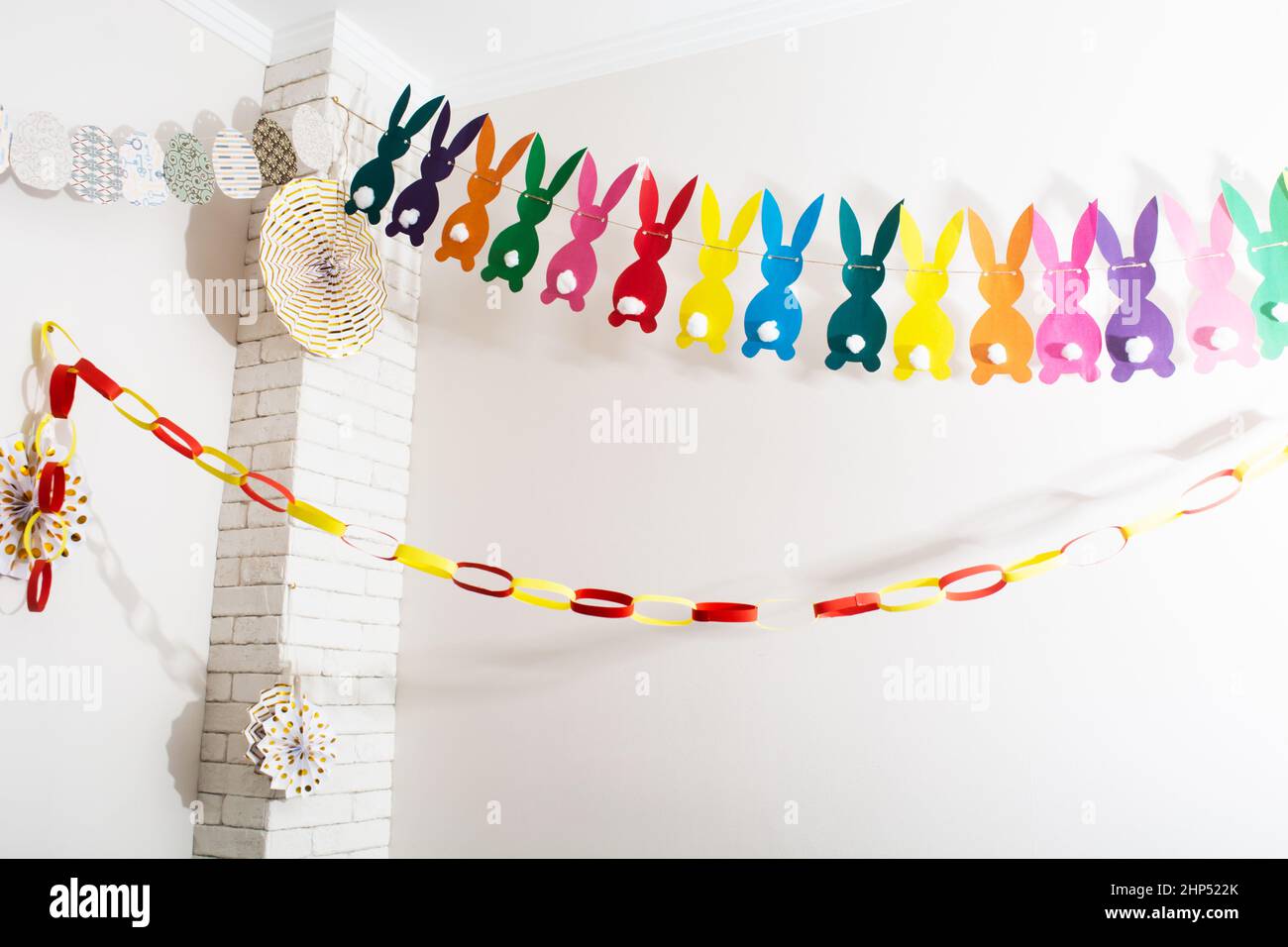 Easter handmade colorful paper garland with rabbits, eggs and cicles Stock Photo